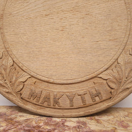 Antique circular Oak bread board carved with “Manners Makyth Man” and the arms of Winchester College England. It is in good original condition, please view photos as they help form part of the description.