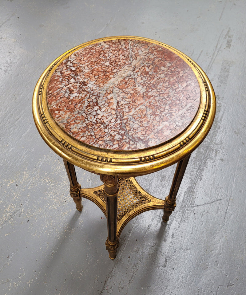 Late 19th Century French Louis XVI style round marble top side table/ lamp table. It is in good original detailed condition and has been sourced from France.