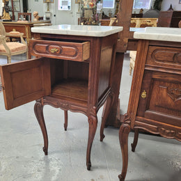 Pair French oak Louis XV style white carrera marble top bedside cabinets. Consisting of one drawer and one cupboard each on elegant legs. Circa: 1900's