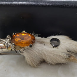 Scottish Grouse foot with Amber coloured glass. In good original condition, please view photos as they help form part of the description.