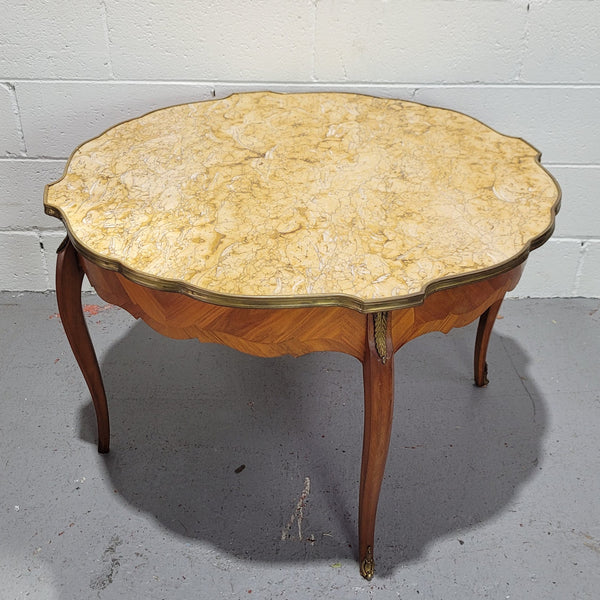 Louis XV style parquetry inlaid coffee table with shaped marble top and ormolu decoration. In good original detailed condition.