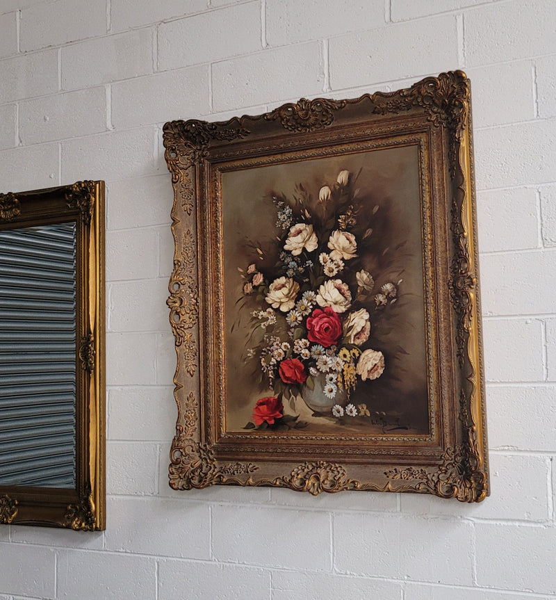 Attractive French floral oil on canvas - signed. Mounted in a stunning patterned gilded frame. It is in good original detailed condition.