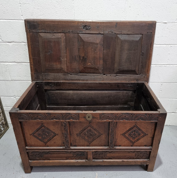 Early 19th Century French Oak carved coffer with a lift up lid for storage. A beautiful piece and in good original condition.