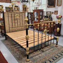 Rare Antique cast iron and brass Victorian queen size bed. Comes with custom made slats.  It has been sourced locally and is in good original condition.
