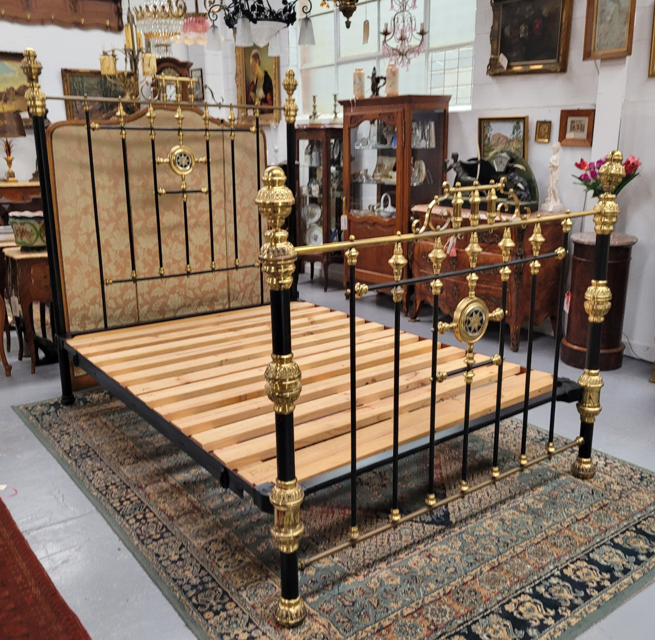 Rare Antique cast iron and brass Victorian queen size bed. Comes with custom made slats.  It has been sourced locally and is in good original condition.