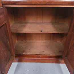 Cedar side cabinet with two doors one drawer and lovely door panels and corbels. It has been sourced locally and is in good original detailed condition.