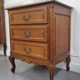French Oak Louis XV style side drawers with lovely handles and three drawers. It has been sourced from France and is in good original detailed condition.