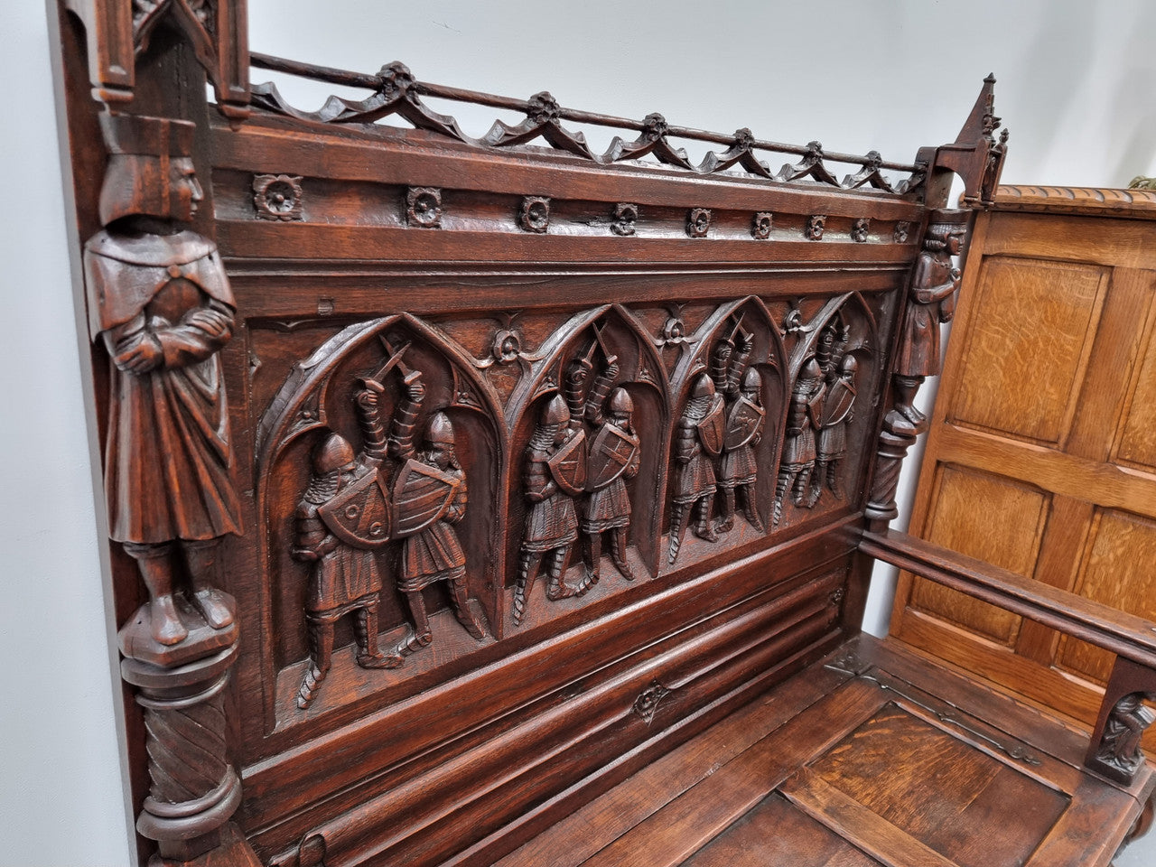 Early 19th Century French Oak Gothic style hall seat with a lift up seat. It has amazing detailed carvings and is in good original detailed condition.