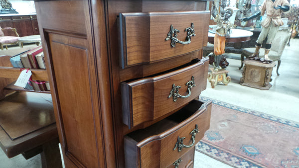 A fabulous petite French Louis XVI style, cherrywood seven drawer semainier. In very good condition.