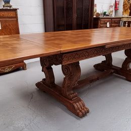 Amazing French Oak Renaissance style parquetry top extension table. Beautiful parquetry top and amazing detailed carvings on the legs. It extends to 306 cm long when fully extended. Sourced from France and in good original detailed condition.