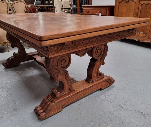 Amazing French Oak Renaissance style parquetry top extension table. Beautiful parquetry top and amazing detailed carvings on the legs. It extends to 306 cm long when fully extended. Sourced from France and in good original detailed condition.