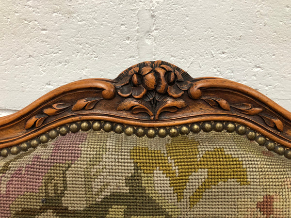 Pair of French Walnut Tapestry covered armchairs. They are in good original detailed condition. Slight wear and tear to fabric but still in good condition please view photos.