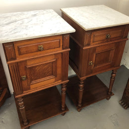A lovely pair of French Oak, marble top bedside cabinets with a cupboard and drawer in good original condition.