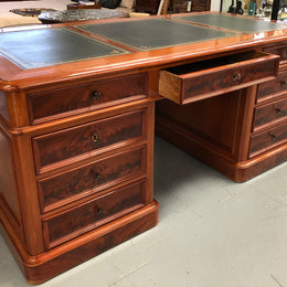 Antique French Mahogany and leather inset top double pedestal partners desk. Plenty of storage space with 9 long drawers on one side and space for someone to sit on the other side. In good restored condition. Circa 1880's.