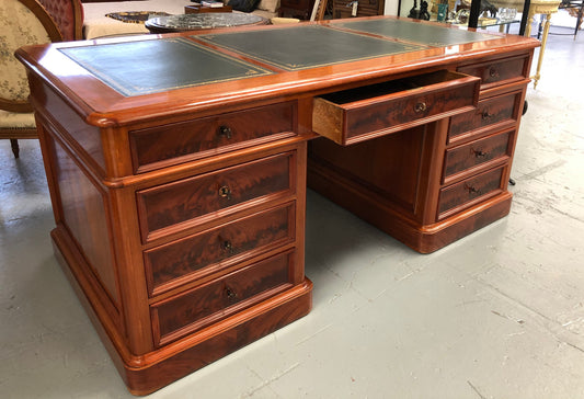 Antique French Mahogany and leather inset top double pedestal partners desk. Plenty of storage space with 9 long drawers on one side and space for someone to sit on the other side. In good restored condition. Circa 1880's.