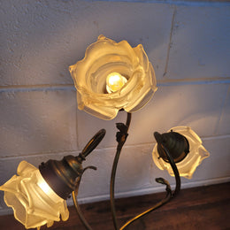 Art Deco alabaster and gilt brass table lamp with three branches and glass tulip shades. In good original detailed working condition.