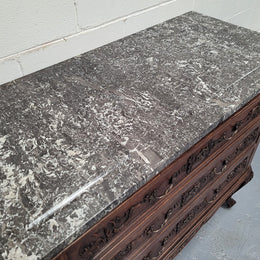 French Oak Louis XV style marble top chest of three drawers. It has beautiful carvings on the drawers with lovely decorative handles all toped with a stunning black and white marble top. In good original detailed condition.