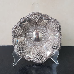 A Sheffield sterling silver bowl with repousse pattern, hallmarked WALKER & HALL and in good original condition.