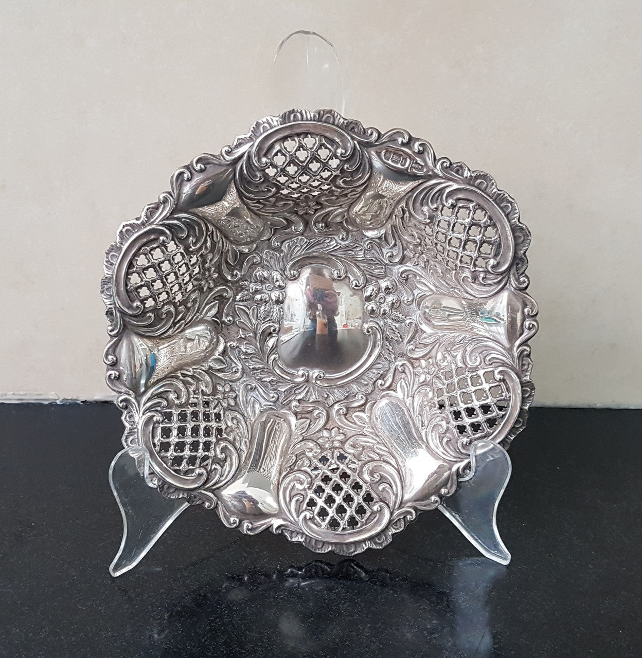 A Sheffield sterling silver bowl with repousse pattern, hallmarked WALKER & HALL and in good original condition.