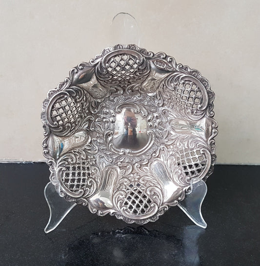 A Sheffield sterling silver bowl with repousse pattern, hallmarked WALKER & HALL and in good original condition.