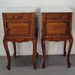 Pair of stunning Louis XV style French Walnut white marble top bedside cabinets. They have one drawer and a cupboard that is marble lined. The marble has been polished and they are in good original detailed condition.