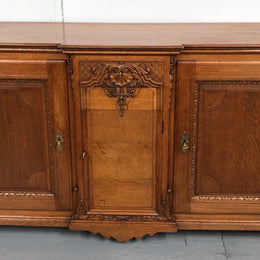 19th century French Oak three door, two drawers buffet with beautiful detailed carving. In good original detailed condition.