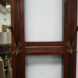 Beautiful English Edwardian tiled back hall stand, with nine brass hooks, two small drawers and retaining it's original mirror and showing signs of age. In good original condition.