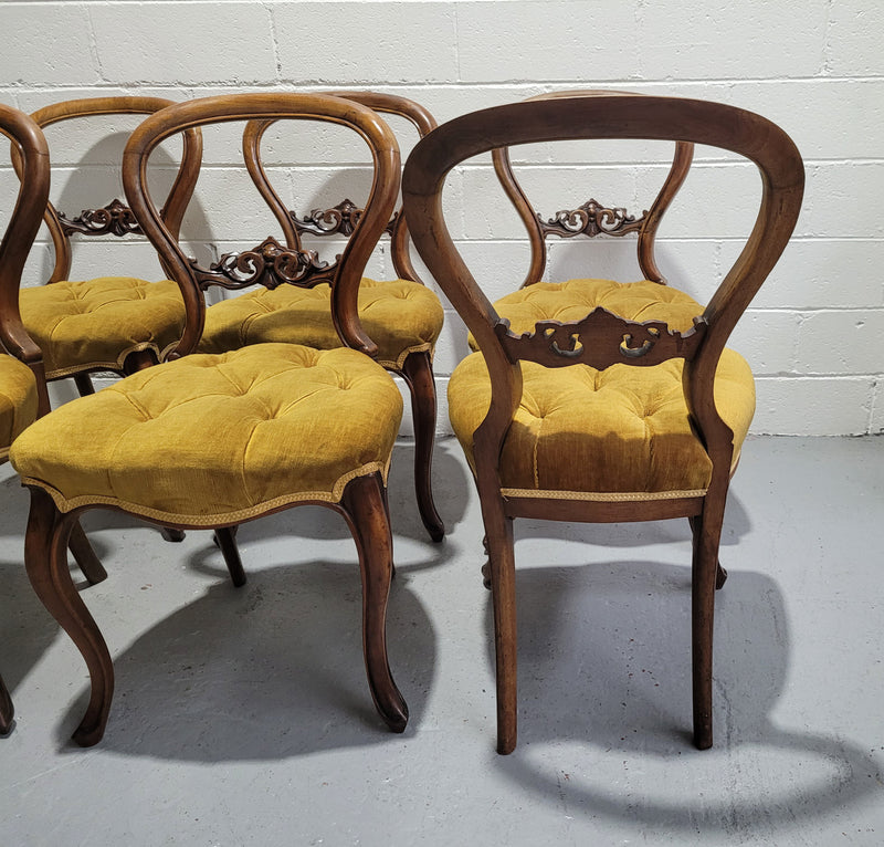 Set of six upholstered Victorian balloon back chairs. In good original detailed condition.