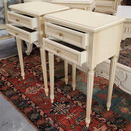 Pair of Vintage Louis 16th style painted crackle finish two drawer French style bedsides. They have elegant reeded legs and have been sourced from France. They are in good original condition.