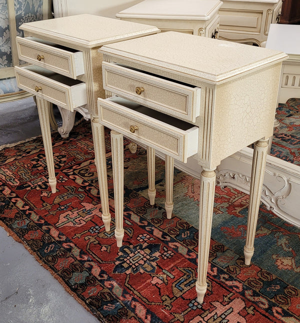 Pair of Vintage Louis 16th style painted crackle finish two drawer French style bedsides. They have elegant reeded legs and have been sourced from France. They are in good original condition.