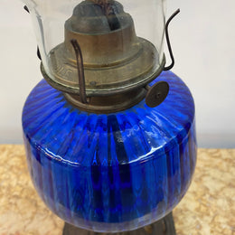 Victorian blue glass kero lamp with decorative metal base. Circa 1880's.