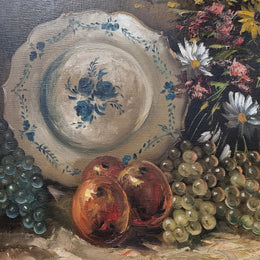 Beautiful signed oil on canvas of a still life framed in an ornate frame. Sourced in France and in good original condition.