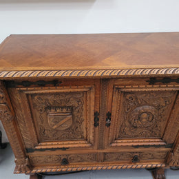 Large French Oak Renaissance style four door sideboard/buffet. Great decorative item with amazing carvings and stunning iron work on base. It is in good original detailed condition. Can pull apart completely making it easier to move.