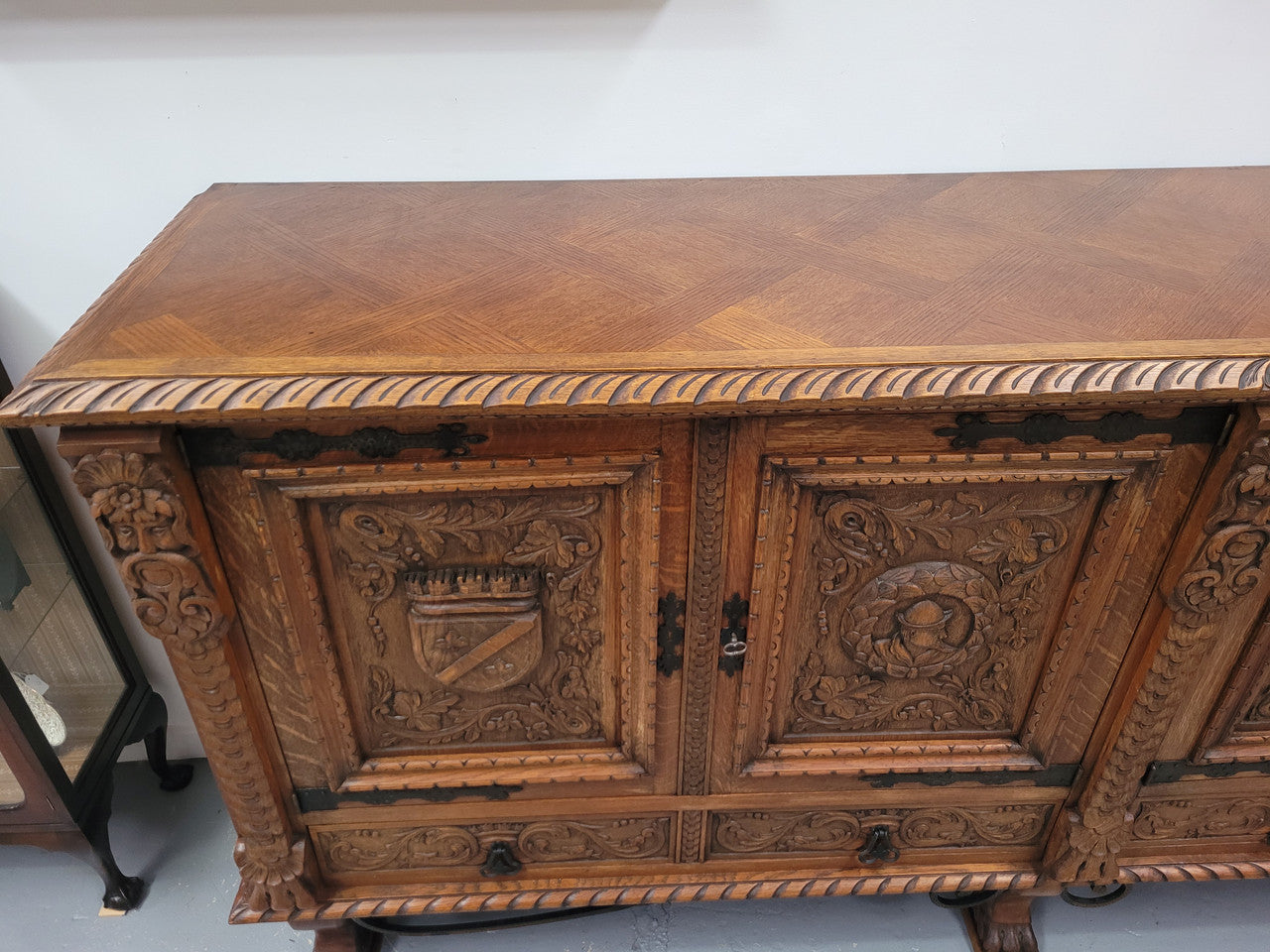 Large French Oak Renaissance style four door sideboard/buffet. Great decorative item with amazing carvings and stunning iron work on base. It is in good original detailed condition. Can pull apart completely making it easier to move.