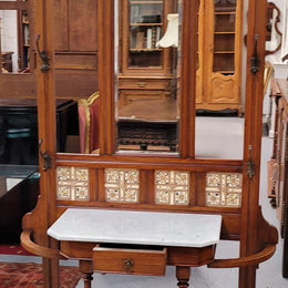Late Victorian Arts and Crafts style marble top hall stand. Features three attractive tiles, original hooks and single drawer. In good original condition.