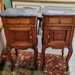 Pair of Walnut Louis XV style grey marble top bedside cabinets. Single drawer, one cupboard and lovely French cabriole legs. They have been sourced from France and are in good original condition.
