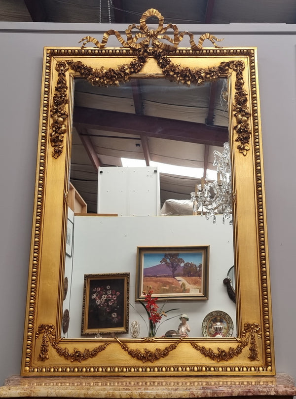 Stunning Vintage French floral gilt framed overmantel mirror. It has been sourced from France and is in good original detailed condition.