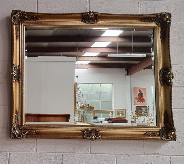 Decorative Vintage gilt bevelled mirror. In good original detailed condition.