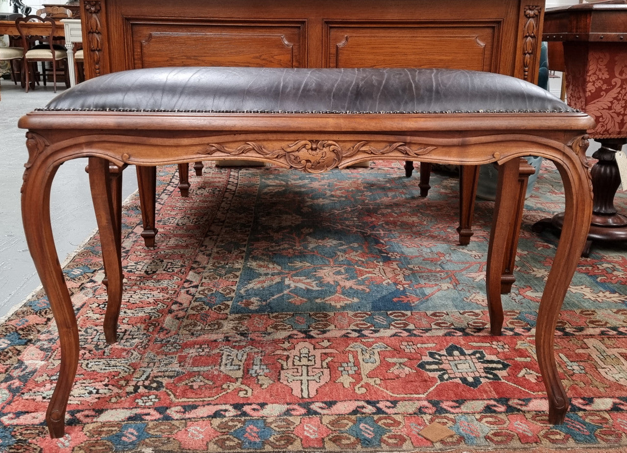 Impressive French Louis 15th style walnut upholstered duet leather stool. Very Good Condition.  Circa: 1930’s, sourced in France.