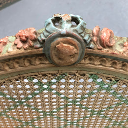 Painted French Louis XVI style cane panel arm chair. Paint is original and it is in very good original condition.