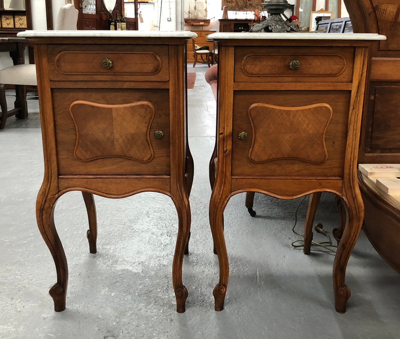 A beautiful pair of French walnut, marble top bedsides with a drawer and cupboard in good condition.