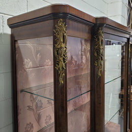 Beautiful French Louis XV style large walnut display cabinet with lovely ormolu mounts . There are two glass shelves and has its original dusky pink fabric in good condition.
