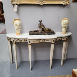 French Louis XVI style painted marble top console table. It is of pleasing narrow proportions and has been sourced from France. It is in good original detailed condition.