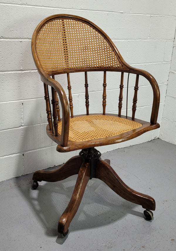 Elm Bentwood and cane swivel desk chair. In good original detailed condition and is comfortable to sit in.