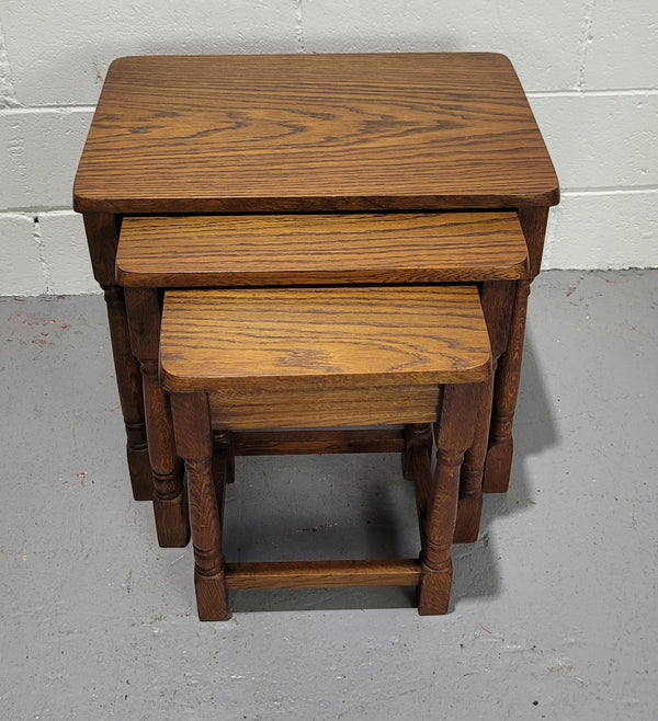 Lovely tudor oak style three nest tables. Circa 1950, In good original detailed condition.