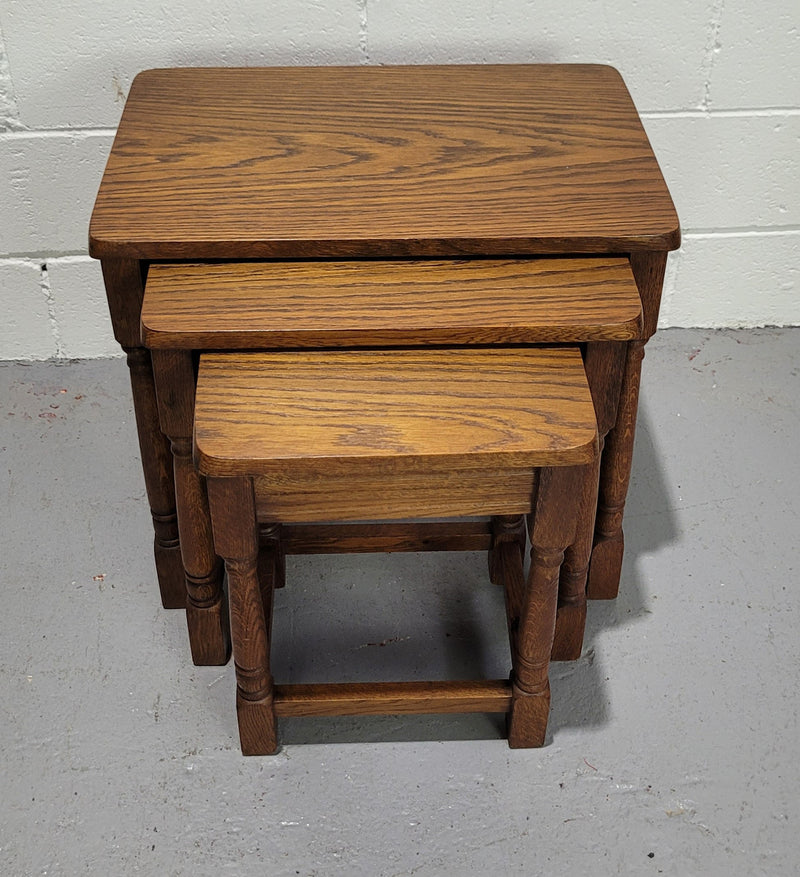 Lovely tudor oak style three nest tables. Circa 1950, In good original detailed condition.