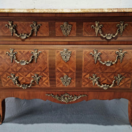 A beautifully inlaid parquetry three drawer commode with a lovely marble top, and decorative ormolu mounts. In good original detailed condition. Circa 1930