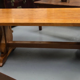 A French Style Oak stretcher base table with amazing wood grain. Can comfortable sit 6-8 people and is in original detailed condition.
