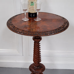 Rare early Victorian Irish Burr Walnut wine table. It has a beautiful carvings and a stunning burr walnut top, on a barley twist column and three shaped legs. It has been sourced locally and is in good original detailed condition. We also have a second table being sold separately which when together make a matched pair.