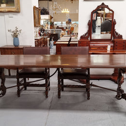 Amazing hard to find French Fruitwood Spanish style 3 meter dining table. Decorative iron work underneath and in good detailed original condition.
